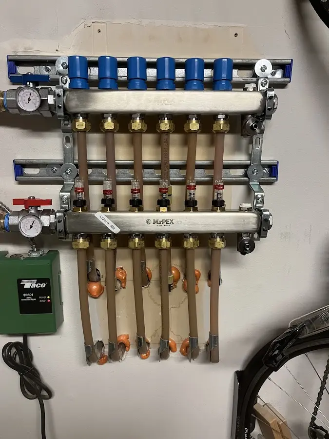 Plumber performing Water Heater Repair at a residential property in La Marque